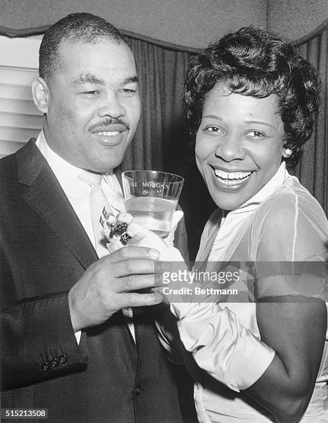 St. Albans, NY - Joe Louis and the former Rose Morgan drink a toast of champagne after their wedding Christmas Day at the Bride's home in St. Albans....