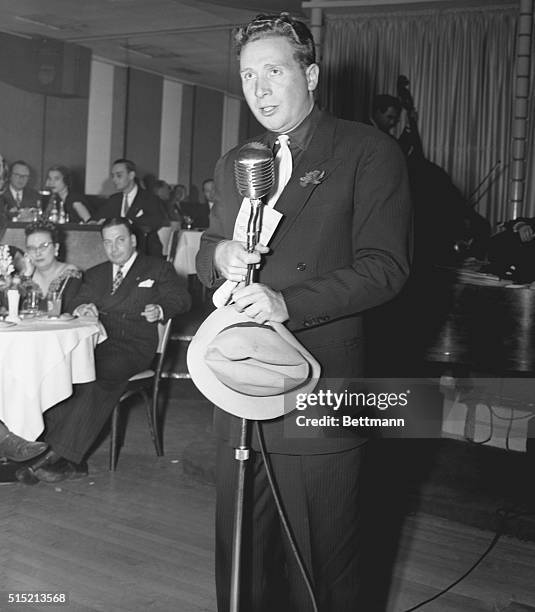 New York- Charles Trenet, French singing star who opened at the Embassy Club shown at microphone as he was called back several times for encores,...