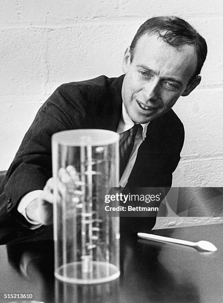 Harvard biology professor James Watson displays a model of DNA in his laboratory. Watson won the 1962 Nobel Prize for Medicine for helping to...