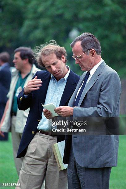 Washington, D.C.- President Geroge Bush is handed a note and is briefed by special assistant to the president Richard Haass, National Security...