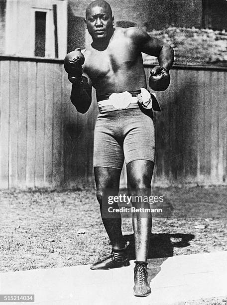 Shown in a fighting pose is Jack Johnson former heavyweight champion of the world, who died at St. Agnes Hospital in Raleigh, North Carolina of...