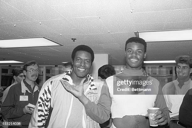 New York, NY - Seattle Mariners' Ken Griffey Jr. , is congratulated by his dad Ken Griffey after game against Yankees at Yandee Stadium 4/26. Griffey...