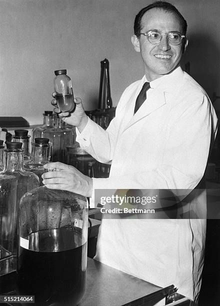 Dr. Jonas Salk stands in the University of Pittsburgh laboratory where he works on perfecting his vaccine for polio