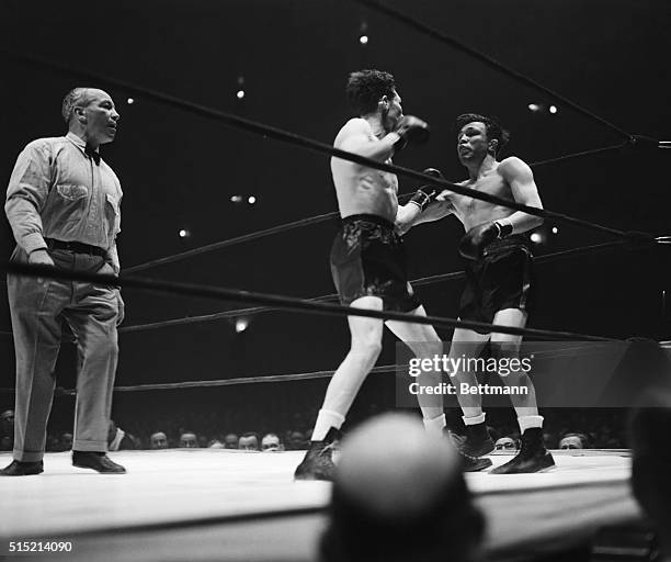 New York- Young Lew Jenkins, Texas knockout artist, and lightweight champion Lou Ambers in the ring at Madison Square Garden. Jenkins dropped Ambers...