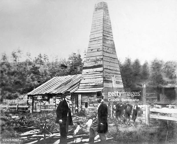 The first productive oil well in the United States discovered by Edwin L. Drake who is shown in the right foreground with a beard and top hat.