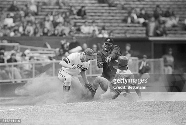 Cleveland, OH- Indians' Buddy Bell puts the tag on Texas' Dave Nelson, who was cut down in the 10th inning while trying to steal third. Bell takes...