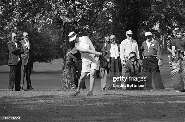 Chicago, IL- Betsy Rawls of Spartensbury South Carolina, defending champion, takes a shot from a position near the crowd, on the 9th hole of the...