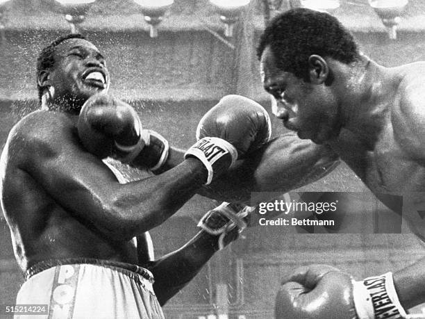 Las Vegas, NV- WBC heavyweight champion Larry Holmes survived blows like this in the 15th round from Ken Norton to score a split decision at Caesars...