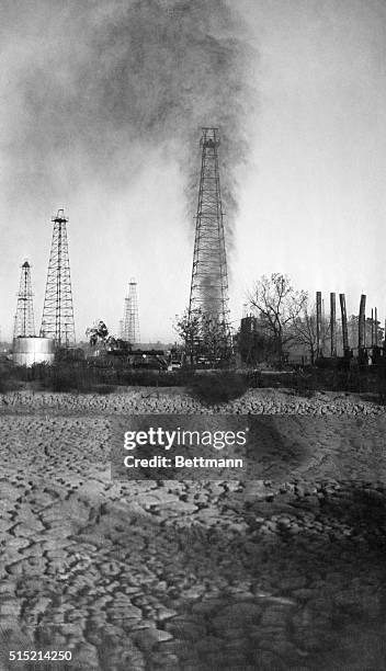 Oklahoma City, Oklahoma- Spouting out approximately $50,000 of oil daily, this wild gusher near Oklahoma City appeared certain to burst into flames...