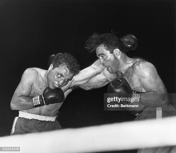 Detroit, Michigan- Here in the Ninth Round, Jake La Motta, , exchanges blows with Marcel Cerdan. La Motta, the "Bronx Bull" wrested the World's...