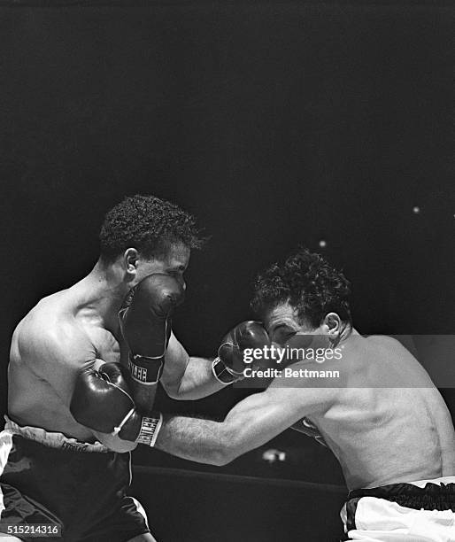 New York, NY- Coming in close, Billy Fox lands a smashing left on the eye of Jake La Motta during their scheduled 10-round bout at Madison Square...
