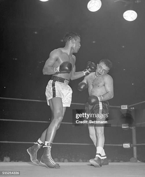 Chicago, IL- You can almost see the middleweight boxing crown topple from Jake LaMotta's head as Sugar Ray Robinson batters him in the 13th round of...