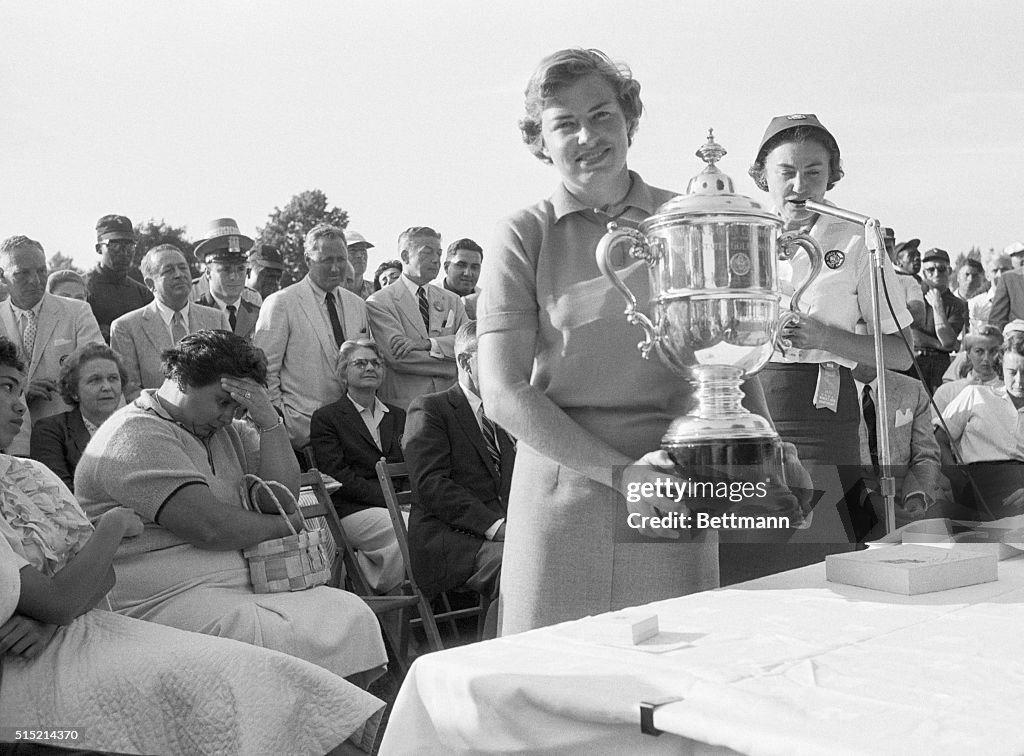 Golfer Betsy Rawls Holding a Trophy