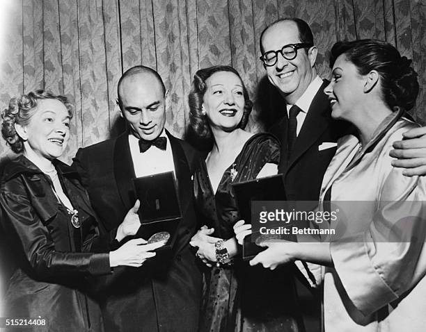 New York, NY- Miss Helen Hayes, president of the American Theatre Wing, is shown presenting Antoinette Perry Awards to some of the winners at the...