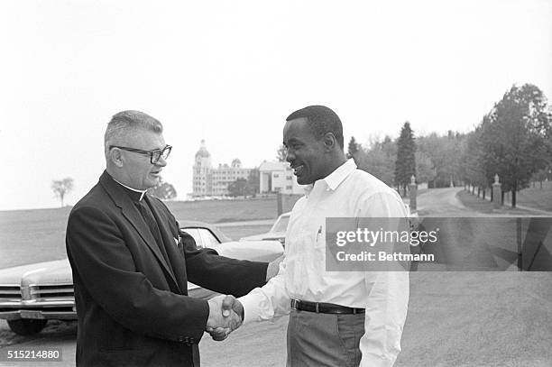 Poland Spring, ME- Heavyweight boxer Sonny Liston says goodbye to an old friend, Rev. Aloysius J. Stevens, of Monett, MO, here May 26, the morning...