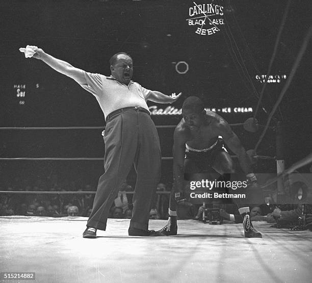 Carmen Basilio-Johnny Saxton fight... The Kayo... Referee gives the signal that it's all over.