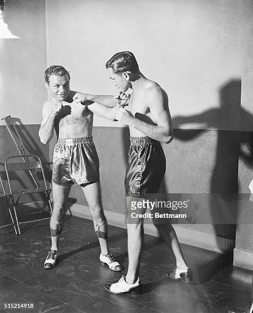 New York, NY- Tony Canzoneri and Barney Ross square off after weighing-in ceremonies at the State Building in New York a few hours before their...