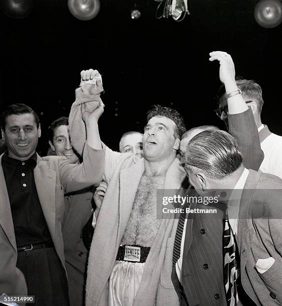 Jersey City, NJ- His face showing happy surprise, Marel Cerdan raises his right hand in a token of victory at Roosevelt Stadium. The French "Tiger...