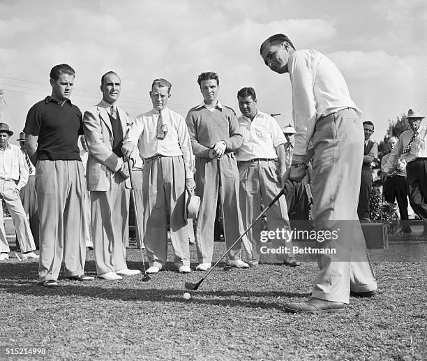 Miami, Florida- Harold "Jug" McSpaden of Winchester, MA, the defending champion, attracts a gallery to see "how it's done" as he tunes up for the...