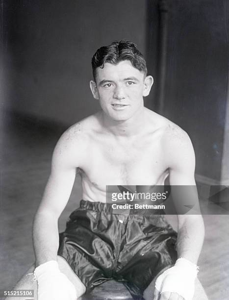 James J. Braddock, promising light heavyweight in training for future bouts, is shown seated.