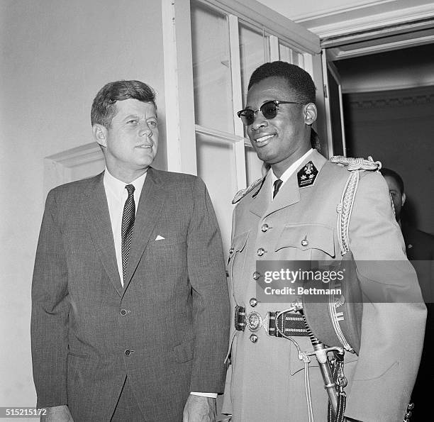 Washington, D.C.- President Kennedy poses with Maj. Gen. Joseph Mobutu, commander of the Congolese army, after their White House meeting today. It...