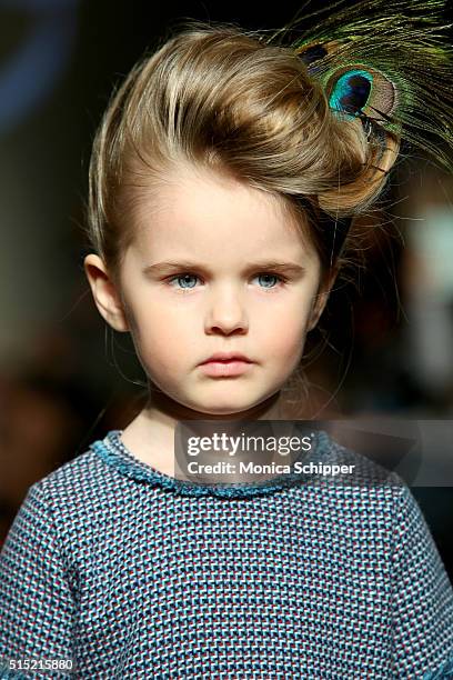 Model, wearing Baby CZ by Carolina Zapf, walks the runway at petitePARADE / Kids Fashion Week, NYC on March 12, 2016 in New York City.