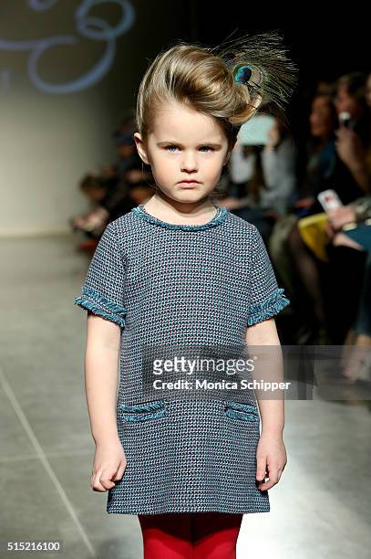 Model, wearing Baby CZ by Carolina Zapf, walks the runway at petitePARADE / Kids Fashion Week, NYC on March 12, 2016 in New York City.