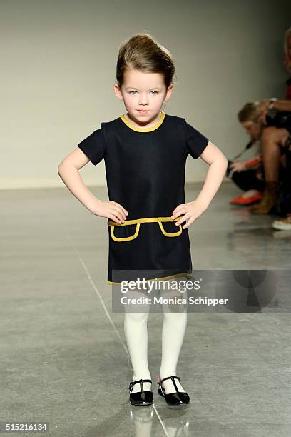 Model, wearing Baby CZ by Carolina Zapf, walks the runway at petitePARADE / Kids Fashion Week, NYC on March 12, 2016 in New York City.