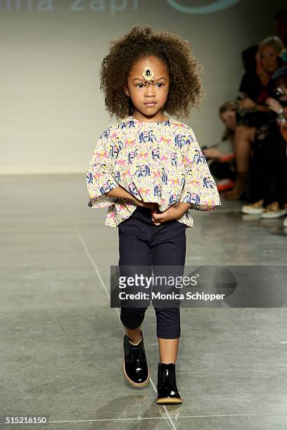 Model, wearing Baby CZ by Carolina Zapf, walks the runway at petitePARADE / Kids Fashion Week, NYC on March 12, 2016 in New York City.