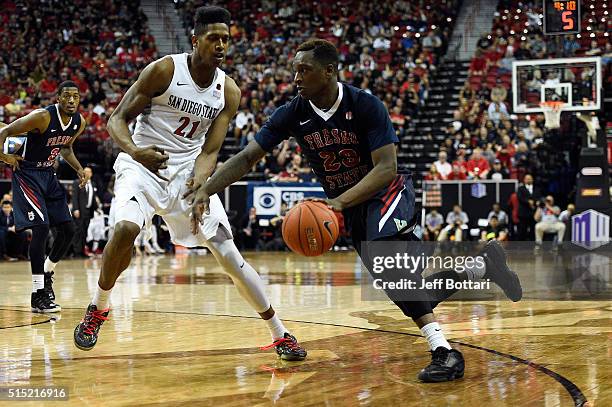 Marvelle Harris of the Fresno State Bulldogs drives to the hoop against Malik Pope of the San Diego State Aztecs during the championship game of the...