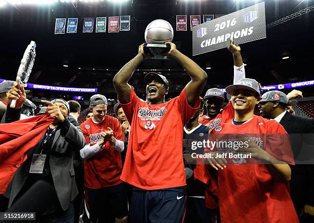 Marvelle Harris of the Fresno State Bulldogs celebrates after receiving the MVP trophy after defeating the San Diego State Aztecs 68-63 to win the...