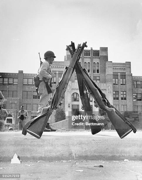 Little Rock, AR- Central High School here September 10th still looks like an armed camp as National Guardsmen stand watch to keep out Negro students....