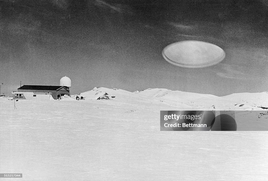 Ufo Over Barn In Snow Covered Field