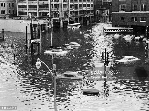 One of the areas hardest hit by a hurricane of 1938 again suffered great damage when Hurricane Carol hit New England in 1954. A downtown street in...