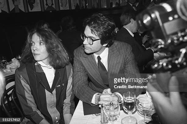 New York- Warren Beatty, star and director of the movie, "Reds," shares a table with his co-star of the film, Diane Keaton, at the New York Film...
