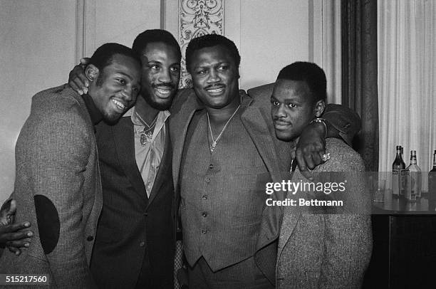 New York, New York- Former world heavyweight boxing champion Joe Frazier poses with his sons, : Mark, Marvis and Joe Jr. At a press luncheon at the...