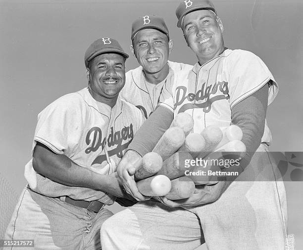 Vero Beach, FL-Big timber boys of the Brooklyn Dodgers oblige with a smiling closeup at the Dodgers' spring camp at Vero Beach. They are : Roy...