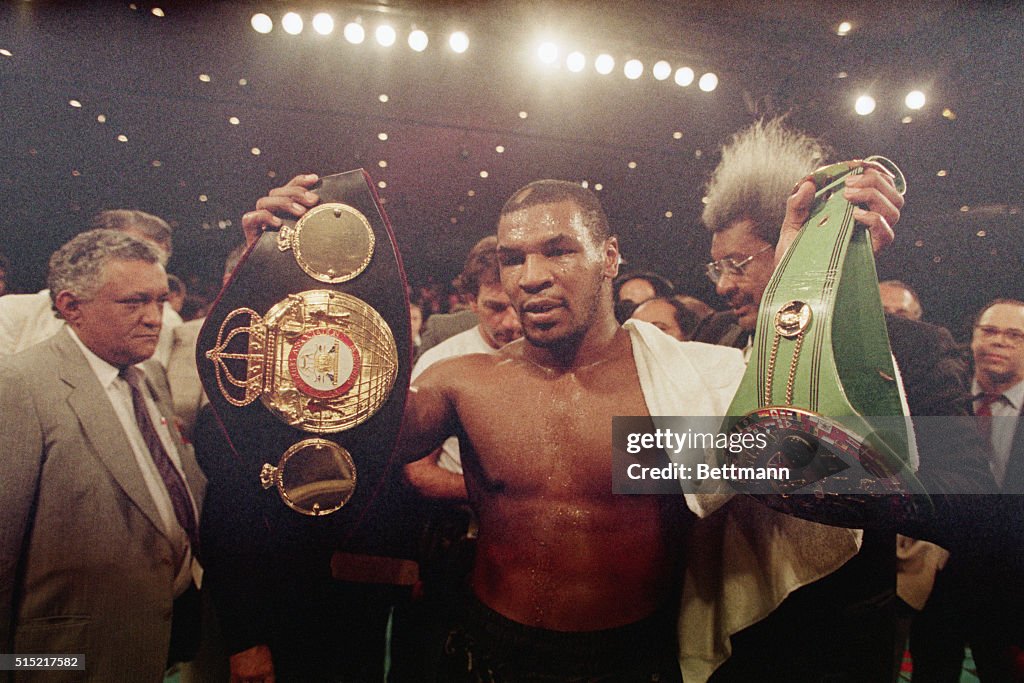 Mike Tyson Holds Belts He Won In Ring