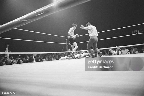 Inglewood, CA- Referee Larry Ozadilla signals that it's all over for Australia's Lionel Rose in the fifth round of Rose's fight with Ruben Olivares...