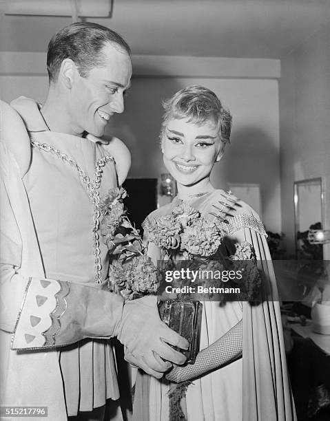 New York, NY- Audrey Hepburn is shown with a bouquet of flowers, after the premiere of "Ondine" at the 46th Street Theater. The flowers were given to...