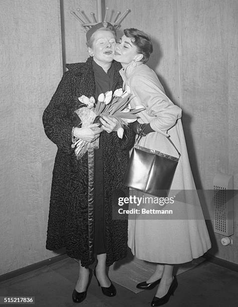 Hoboken, NJ- Baroness Ella Van Heemstra is warmly greeted by her daughter, stage and screen star Audrey Hepburn, aboard the liner Nieuw Amsterdam,...