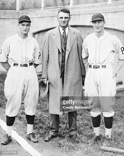 Photo shows former Pittsburgh Pirates player Max Carey , now of Brooklyn, with the Waner brothers, Lloyd and Paul.