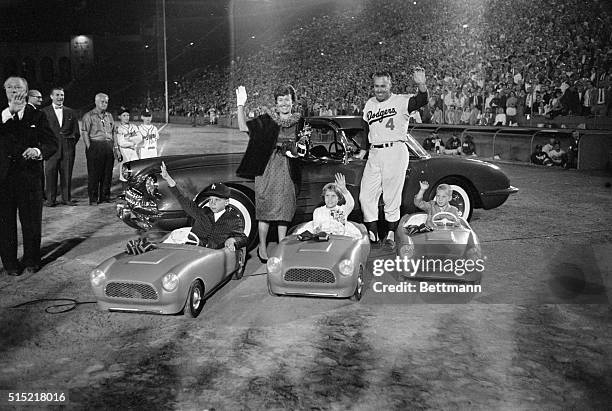 Los Angeles, California- Los Angeles outfielder and his family wave from part of the gifts given to Snider on "Duke Snider Night" at the Los Angeles...