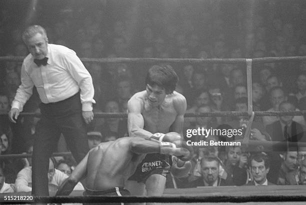 Paris, France- Swinging his massive right fist like a sledgehammer, Carlos Monzon of Argentina, pounded challenger Jose Napoles into defeat, 2/9,...