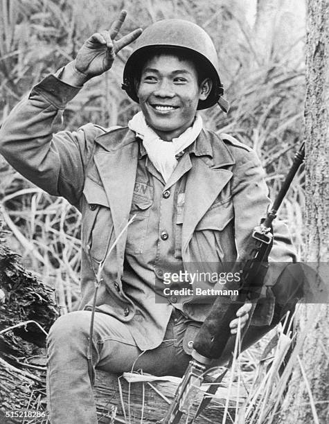 Bac Binh Vuong, South Vietnam- This South Vietnamese soldier might be said to be a picture of optimism as he takes a break during an operation in the...