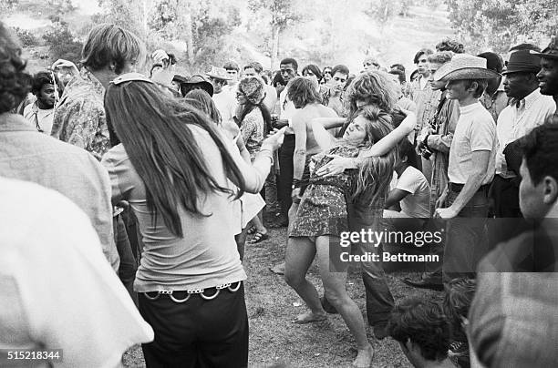 Los Angeles, California- A couple of girls do a dance at a "love-in" held at Elysian Park 9/22. Out breaks of violence were reported as a crowd of...