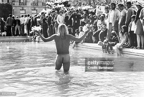 San Francisco, CA- An unidentified young man with long hippie-type hair cavorts in the altogether, in the San Francisco Civic Center Plaza fountain,...