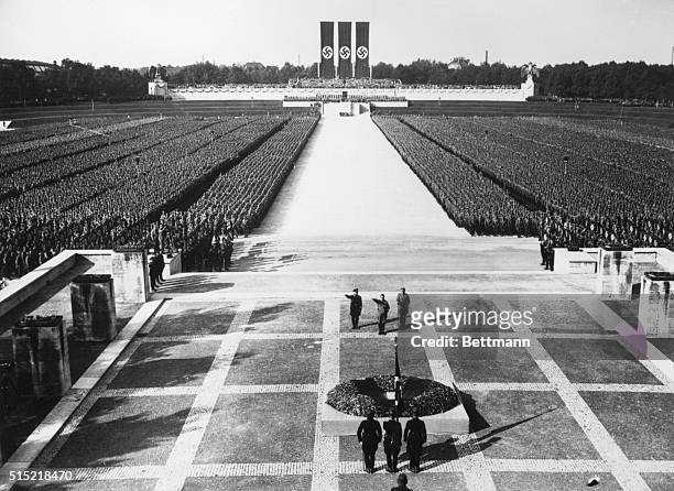 The imposing scene during the last hours of the Nazi Congress at Nuremberg, as Leader-Chancellor Adolf Hitler saluted the Nazi dead as thousands of...