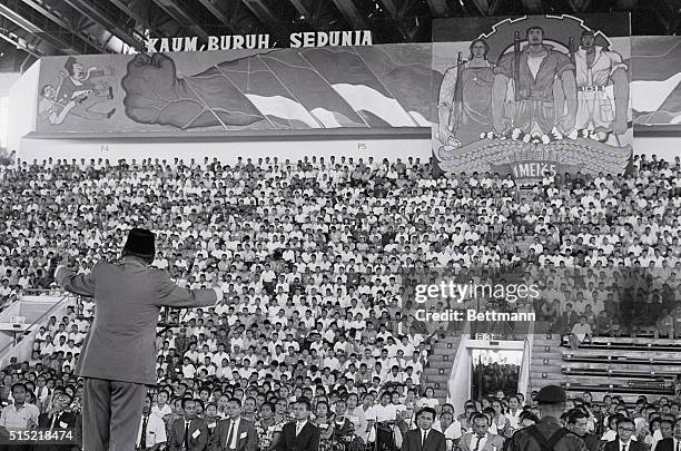 Djakarta, Indonesia- President Sukarno of Indonesia addresses a mass May Day rally in the Sports Hall Building. Sukarno announced his decision not to...