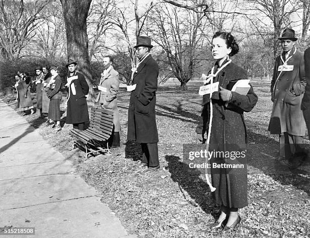 Protesters stand outside the Daughters of the American Revolution Museum with placards and nooses around their necks, Washington DC,12th December...